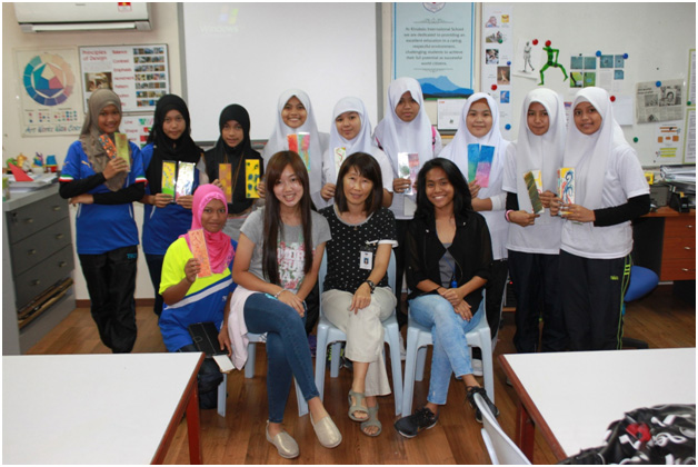 Group of students, teacher from KIS, and student assistant.