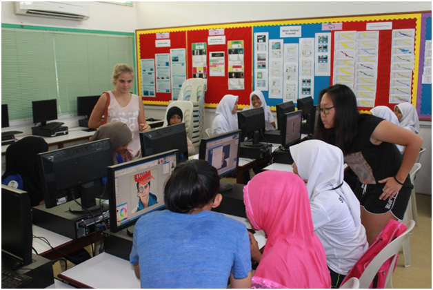 ICT class session for students and assisted by the student assistant from KIS.